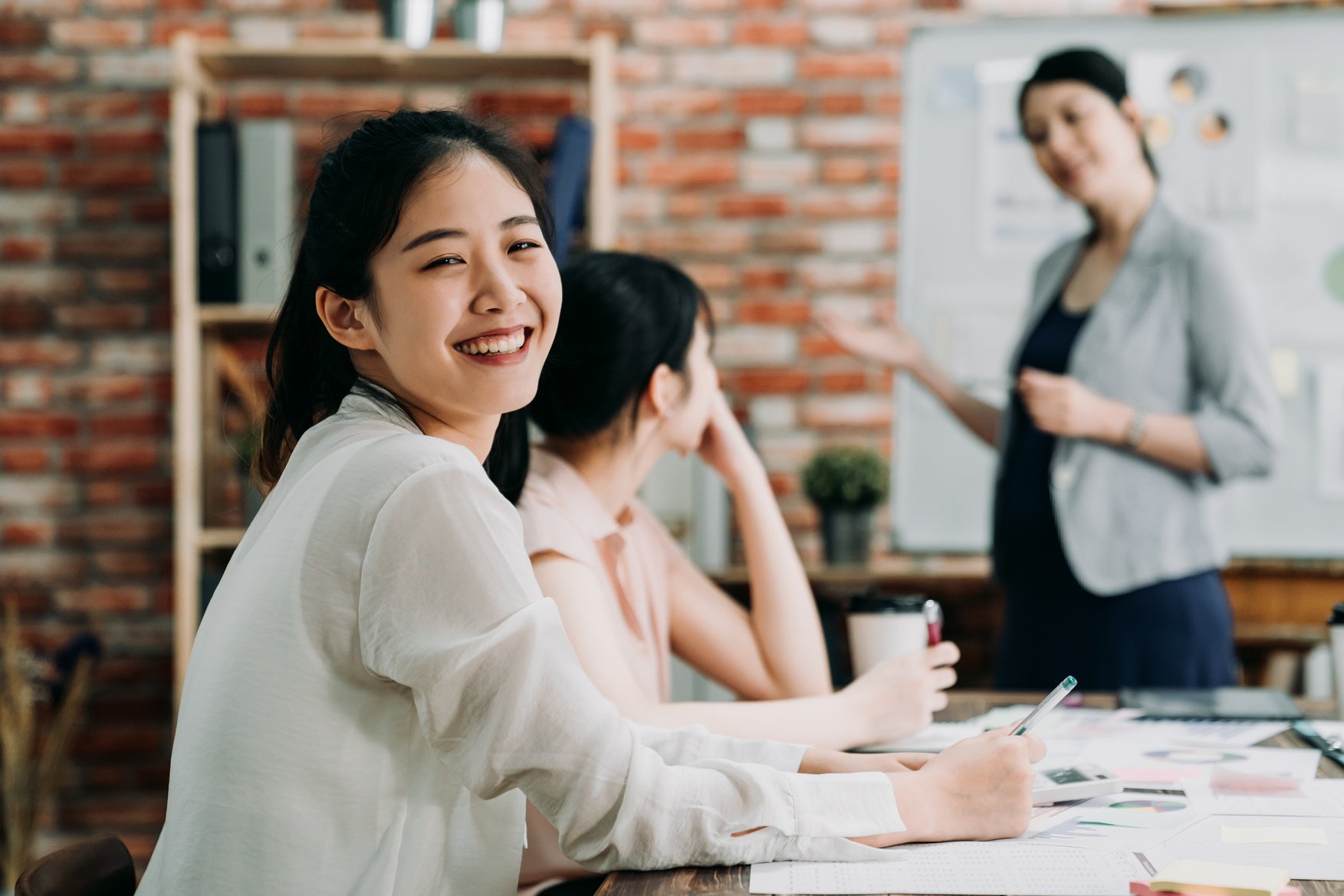 Happy Female Employee in a Meeting